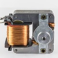 shaded pole motor. Notice that bracket holding rotor bearings is not magnetic: a magnetic bracket would shunt the magnetic field around the rotor.