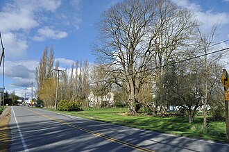 This image of the road leading into Edison, Washington from the south is part of a new Washington State History Museum interactive exhibit called Encyclopedia Washingtonia, in the category "On the Move/From Here to There/To Market, To Market"…