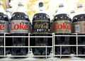 X is the product labels (allowed as the designs are below TOO; see also Ets-Hokin v. Skyy Spirits, Inc.). Simply depicting multiple Xs grouped together does not qualify as de minimis; contrast with criteria 3 and 5 above. Editing out the labels would defeat the purpose of taking photos of the cola bottles.